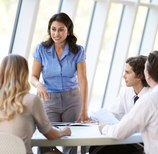 Business People Having Board Meeting In Office