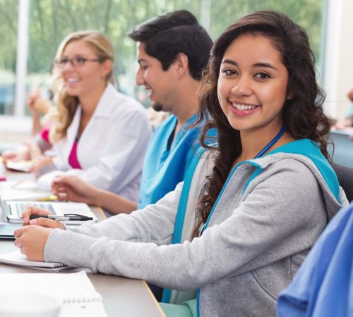 Pretty student smiling in nursing or medical school college class